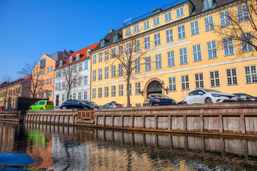 city scene with houses along water canal 