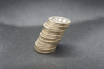 Leaning coin tower with Japanse five hundred coins