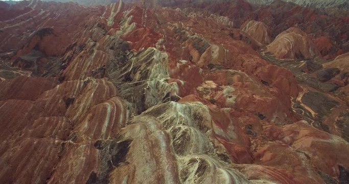 Aerial above view of colorful Danxia rock formations of The Zhangye National Geopark in Gansu province of China, 4k drone nature landscape footage