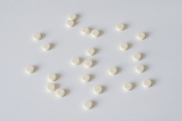 Pills on a white background. The concept of medicine, pharmacy and health care