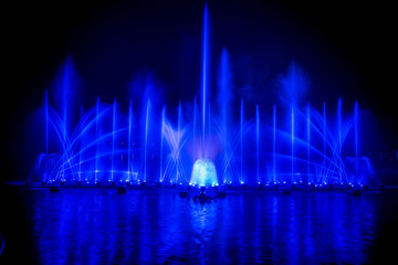 The colorful fountain dancing in celebration festival with dark night sky background.