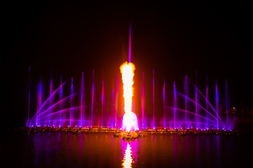 The colorful fountain dancing in celebration festival with dark night sky background.