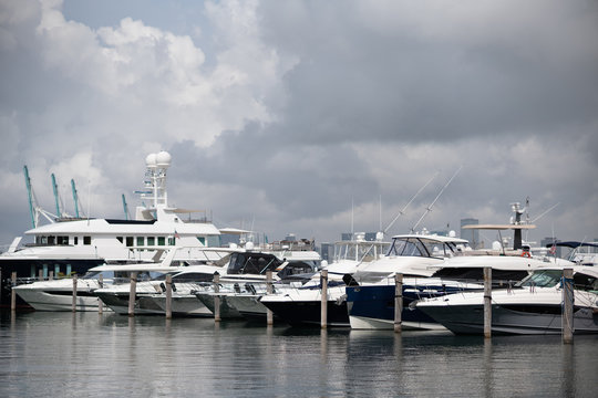 Luxury yachts Miami Beach Marina with overcast clouds storm approaching