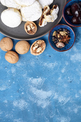 Arabic homemade cookies filled with dates and walnuts covered powdered sugar