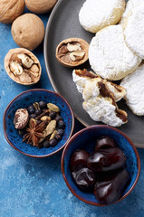 Arabic homemade cookies filled with dates and walnuts covered powdered sugar