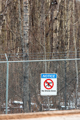 No Drone Zone sign on barb wire fence