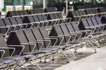 Empty chairs in the departure hall at airport