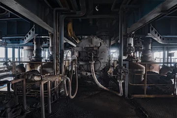 Fotobehang Interieur van een oude verlaten industriële staalfabriek © Bob