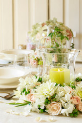 Floral decorations on summer party table,  romantic wedding reception.