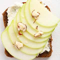 Healthy breakfast. one toast with apple, cheese and hazelnut