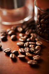Roasted coffee beans on table