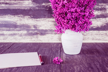 Natural flowers. Lilac in a white vase. Photo in lilac tones