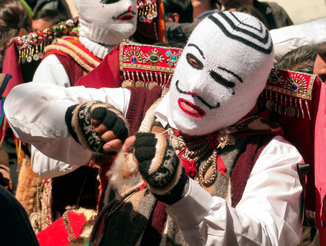 Paucartambo, Cusco, Peru - Circa July 2013: Portrait of man wearing a typical mask at Paucartambo's Festival of Virgen del Carmen. Colorful traditional "Capaq Qolla" dancers with folkloric attire. 