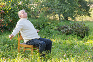 portrait of  elderly man in  park
