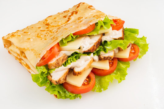 pancake with chicken, tomatoes and lettuce