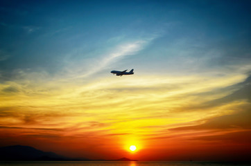 Fototapeta na wymiar beuatiful of colorful sunset background with airplane