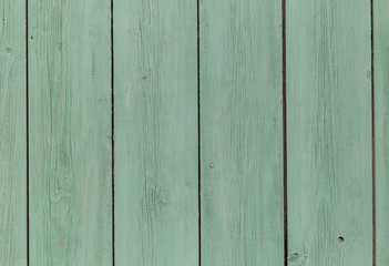 vertically green painted wooden boards