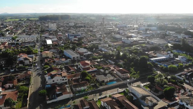 Downtown at South America small city. Cruz das Almas, Bahia, Brazil. Drone slowly moving up 4K