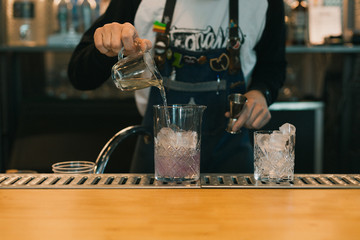 Barman making a cocktail at the bar