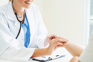 Female patient visits woman doctor or gynecologist during gynaecology check up in office at the...