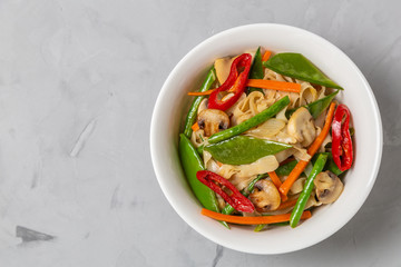 Chow Mein egg noodles with vegetables and mushrooms. The view from the top. Copy-space