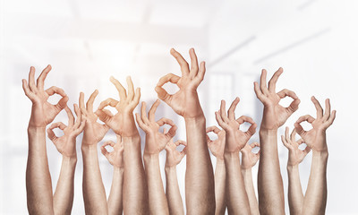 Row of man hands showing okay gesture