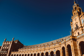 Facades of buildings on the Spanish square or the Plaza de Espana. Andalusia.