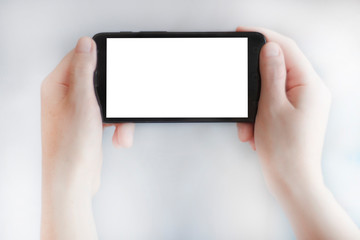 Two hands horizontally hold a mobile phone.