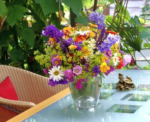 Vibrant Summer Wildflowers in Sunlit Conservatory
