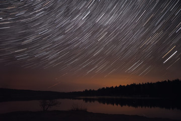 star tracks lake sky forest reflection