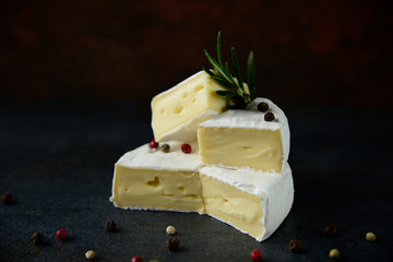 Cheese camembert or brie with fresh rosemary