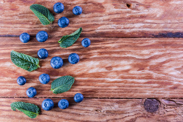Blueberries on a wooden table with free space