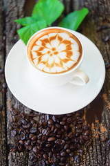 hot cappuccino with nice milk pattern with coffee bean