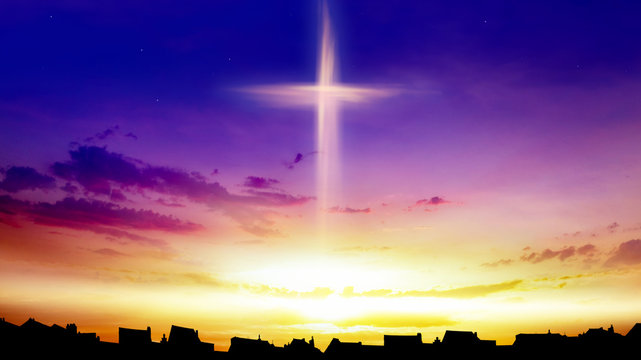 Heaven of paradise and silhouette of the city .  Glowing cross in sky . Happy Easter. Light from sky . Religion background .