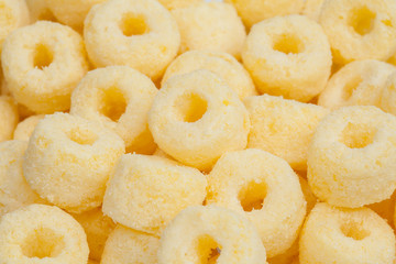 Close up pile of corn ring snack, shots in studio.