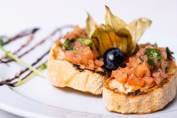 Italian food bruschetta on white background. Macro.