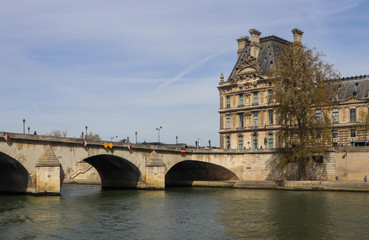 Fototapeta premium One of the oldest bridge ( Pont Royal ) across Seine River and beautiful historic buildings of Paris France. April 2019