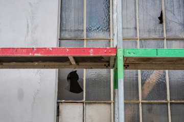 Construction site with steel scaffolding to carry out repairs on the wall