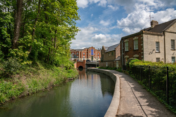 Fototapeta na wymiar A restored section of the Stroudwater Canal under the Stroud Brewery Bridge , Wallbridge, Stroud, United Kingdom