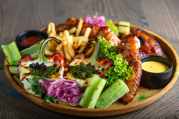Fried chicken wings and French fries. Menu