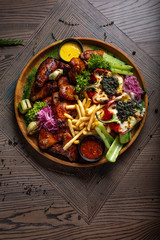 Fried chicken wings and French fries. Menu
