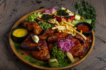 Fried chicken wings and French fries. Menu