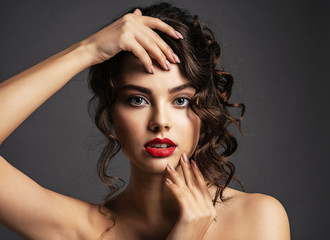 Beautiful young woman with long curly brown hair