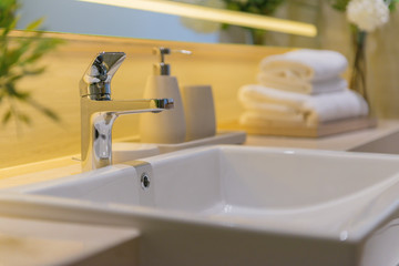 Luxury white porcelain sink on a bathroom table 