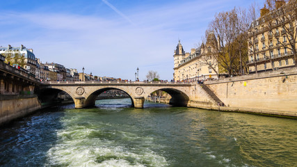 Bridge Pont Saint-Michel across Seine River and  beautiful historic buildings of Paris France. April 2019