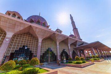 Kuala Lumpur/Malaysia: 22 April 2019: beautiful dome lid pink Masjid Putra Putra Mosque Muslim mosque of Putrajaya famous tourist destination religion in Malaysia