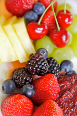 fruit salad on plate with berries