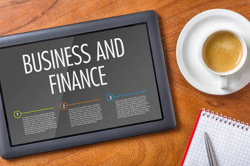 Tablet on a wooden desk - Business and Finance