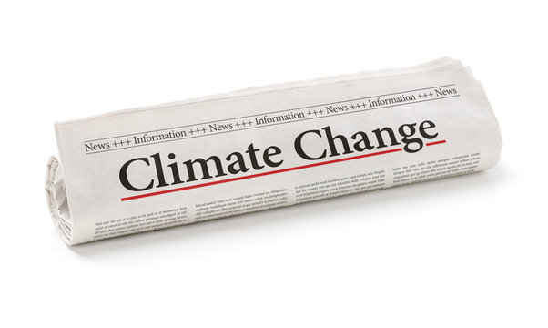 Rolled newspaper with the headline Climate change