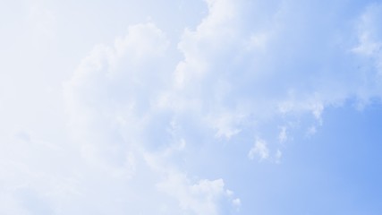 Scenic soft light sky. Beautiful white soft fluffy clouds on a blue sky background. 16:9 panoramic format